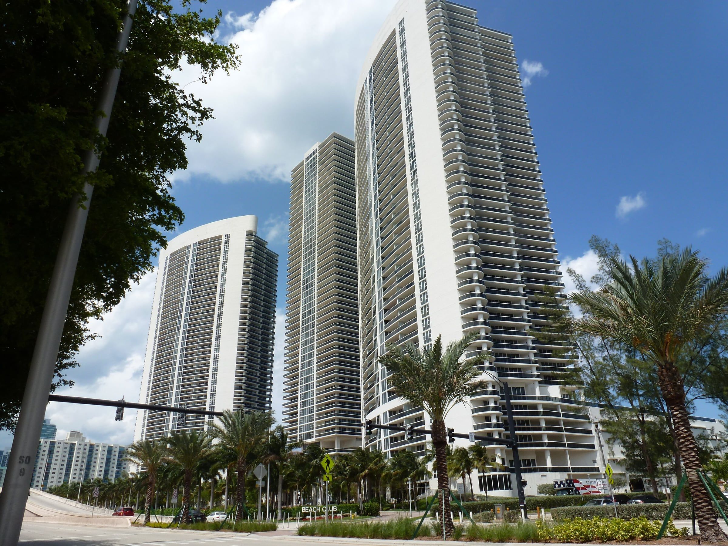 Condo towers over palm-lined A1A in Hallandale Beach